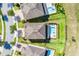 Aerial view showing a property line and the backyard pool and manicured lawn of a well-maintained home at 7527 Marker Ave, Kissimmee, FL 34747