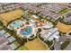 Expansive aerial view of community with pools, a water park, private pools and residences at 7527 Marker Ave, Kissimmee, FL 34747