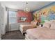 The princess themed room features two twin beds, large mural and decorative chandelier at 7527 Marker Ave, Kissimmee, FL 34747