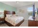 Bedroom featuring a bed with coral and sea life bedding, wood furniture and a neutral color scheme at 7527 Marker Ave, Kissimmee, FL 34747