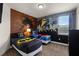 bedroom featuring twin beds with Batman themed decor and large mural at 7527 Marker Ave, Kissimmee, FL 34747