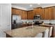 Well-equipped kitchen boasting granite counters, stainless appliances, and ample cabinet space at 7527 Marker Ave, Kissimmee, FL 34747