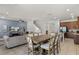 The living room and kitchen feature an open layout, with a dining table in between at 7527 Marker Ave, Kissimmee, FL 34747