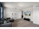 Bright and airy Gathering room featuring a comfortable sectional sofa and modern shelving at 7527 Marker Ave, Kissimmee, FL 34747