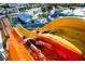 Colorful water slides at the community water park with people enjoying the ride at 7527 Marker Ave, Kissimmee, FL 34747