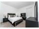 Nicely furnished bedroom featuring plush bedding, carpeted floors, a TV, and bright window at 8967 Chipping Square Ln, Davenport, FL 33896