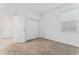 Bright bedroom with carpeted floors, a window, and a closet door that leads to other rooms at 8967 Chipping Square Ln, Davenport, FL 33896
