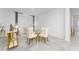 Bright dining area with a glass table, elegant chairs, and natural light at 8967 Chipping Square Ln, Davenport, FL 33896