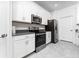 Elegant kitchen boasting stainless steel appliances and sleek countertops at 8967 Chipping Square Ln, Davenport, FL 33896