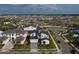 Beautiful aerial view of a modern home in a well-planned community with lush landscaping at 9004 Santorini Dr, Orlando, FL 32827