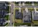 Aerial view of a single Gathering home on a well-maintained lawn in a suburban neighborhood at 9004 Santorini Dr, Orlando, FL 32827