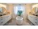 Elegant bathroom with double vanities, a standalone tub, and stylish contemporary accents at 9004 Santorini Dr, Orlando, FL 32827