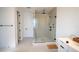 Modern bathroom featuring a glass-enclosed shower with sleek hardware and neutral tiles at 9004 Santorini Dr, Orlando, FL 32827