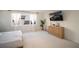 Well-lit bedroom with minimalist decor, light carpet, and an inviting atmosphere at 9004 Santorini Dr, Orlando, FL 32827