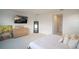 Bright bedroom showcasing a modern dresser, stylish mirror, and minimalist aesthetic at 9004 Santorini Dr, Orlando, FL 32827