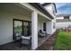 Relaxing covered patio with comfortable seating and easy access to the backyard at 9004 Santorini Dr, Orlando, FL 32827