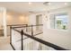Modern hallway showcasing sleek railings, contemporary lighting, and bright, open space at 9004 Santorini Dr, Orlando, FL 32827