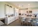 Modern kitchen with quartz countertops, stainless steel appliances, and a large island with seating at 9004 Santorini Dr, Orlando, FL 32827