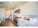 Sleek kitchen featuring modern cabinets, stainless steel appliances, and quartz countertops at 9004 Santorini Dr, Orlando, FL 32827