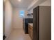 Functional laundry room with modern appliances, storage cabinets, and clean lines at 9004 Santorini Dr, Orlando, FL 32827