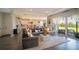Spacious open-concept living room showcasing modern décor and seamless flow to the outdoor patio at 9004 Santorini Dr, Orlando, FL 32827