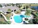 Aerial view of the community pool, clubhouse, and surrounding landscape at 9318 Mclaren Aly, Winter Garden, FL 34787