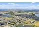 Aerial view of the residential neighborhood, community lakes, and landscaping at 9318 Mclaren Aly, Winter Garden, FL 34787