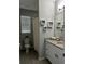 Bathroom features a vanity with granite countertop and modern decor at 9318 Mclaren Aly, Winter Garden, FL 34787