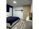 Bedroom featuring contemporary furnishings and an accent wall at 9318 Mclaren Aly, Winter Garden, FL 34787