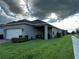 Home exterior with green grass, providing a sense of outdoor space and relaxation at 9318 Mclaren Aly, Winter Garden, FL 34787