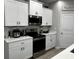 Bright kitchen with white cabinetry, stainless steel appliances, and tile backsplash at 9318 Mclaren Aly, Winter Garden, FL 34787