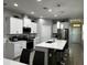 Modern kitchen featuring stainless steel appliances, white cabinets, and a spacious center island at 9318 Mclaren Aly, Winter Garden, FL 34787