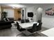 Open-concept living room with modern furniture and decorative wall paneling at 9318 Mclaren Aly, Winter Garden, FL 34787