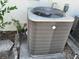 Close-up view of a gray AC unit at 940 Fenton Ln # 8, Lakeland, FL 33809