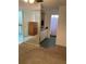 Bedroom area with large mirrored wall and bathroom featuring tiled floors at 940 Fenton Ln # 8, Lakeland, FL 33809