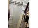Walk-in closet with custom shelving and plenty of storage for clothes and accessories at 940 Fenton Ln # 8, Lakeland, FL 33809