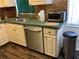 Kitchen featuring a stainless steel dishwasher, sink, faucet, and ample counter space at 940 Fenton Ln # 8, Lakeland, FL 33809