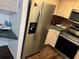 Kitchen with stainless steel refrigerator and modern appliances, and plentiful countertop space at 940 Fenton Ln # 8, Lakeland, FL 33809