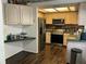 This kitchen features stainless steel appliances, and wood flooring at 940 Fenton Ln # 8, Lakeland, FL 33809