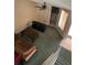Open-concept living room with ceiling fan and doorway with washer and dryer in view at 940 Fenton Ln # 8, Lakeland, FL 33809
