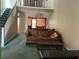 View of the living room featuring staircase and second story view at 940 Fenton Ln # 8, Lakeland, FL 33809