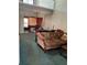 Open-concept living room featuring a vintage chandelier and carpeted floors at 940 Fenton Ln # 8, Lakeland, FL 33809