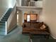 View of the living room featuring staircase and second story view at 940 Fenton Ln # 8, Lakeland, FL 33809