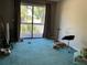 Living room with an exterior balcony and a sliding glass door at 940 Fenton Ln # 8, Lakeland, FL 33809