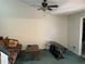 View of a living room with a ceiling fan and brown sofa at 940 Fenton Ln # 8, Lakeland, FL 33809