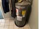 Image of Rheem water heater with caution and warning labels at 940 Fenton Ln # 8, Lakeland, FL 33809