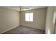 This carpeted bedroom has a ceiling fan and a window for natural light at 1024 Spring Meadow Dr, Kissimmee, FL 34741