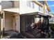 Charming condo entrance with a screened-in porch, attractive landscaping, and unit number 1024 at 1024 Spring Meadow Dr, Kissimmee, FL 34741