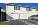 Well-maintained condo building with individual garages and clearly marked unit numbers at 1024 Spring Meadow Dr, Kissimmee, FL 34741