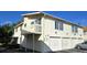 Inviting two-story condo featuring a private balcony and individual garages at 1024 Spring Meadow Dr, Kissimmee, FL 34741